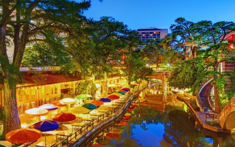 San Antonio River Walk with boats, restaurants, and historic architecture
