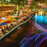 San Antonio River Walk with boats, restaurants, and historic architecture along the river