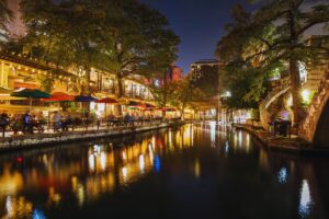 Riverside dining along the San Antonio River Walk at night