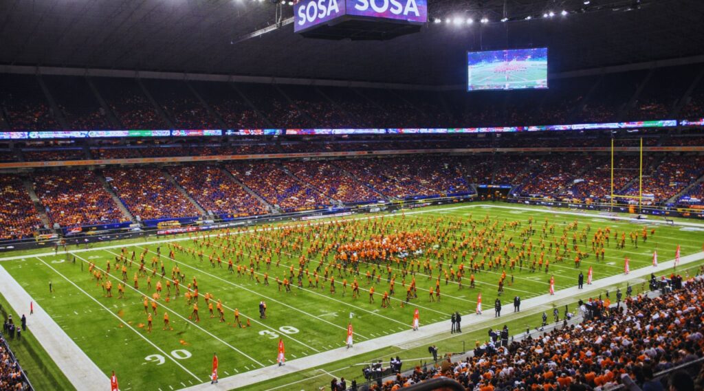 Crowd at sports event near Alamodome San Antonio with fans cheering